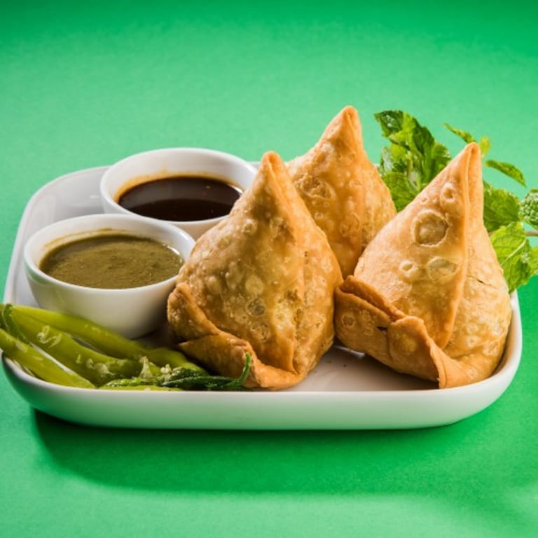Savor Our Crispy Samosas